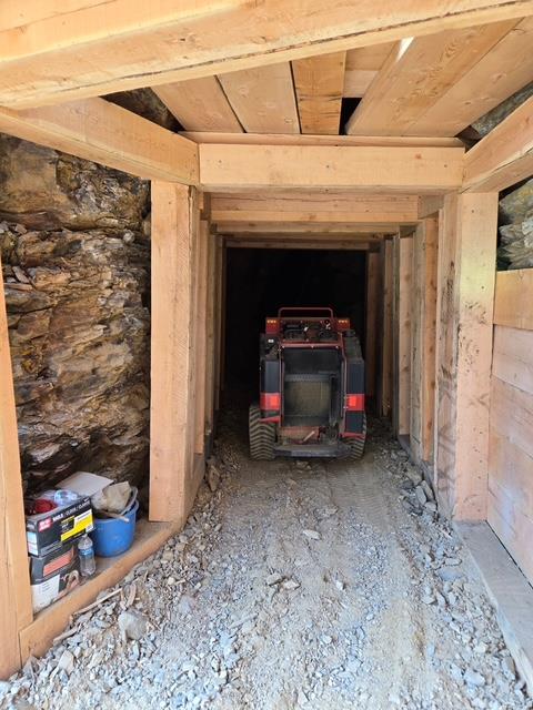 A tractor in a tunnel AI-generated content may be incorrect.