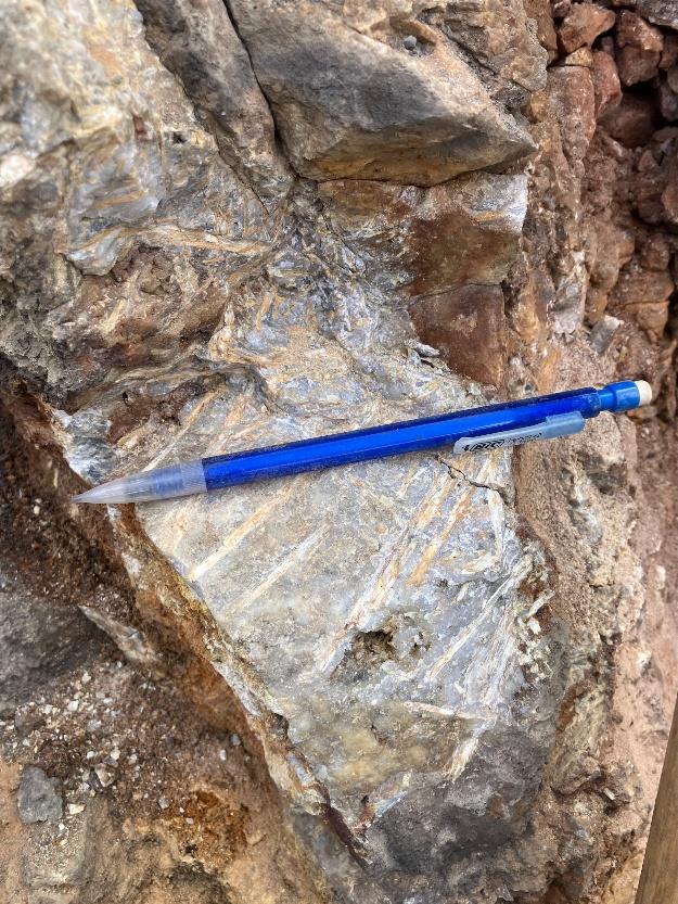 A blue pen on a rock AI-generated content may be incorrect.