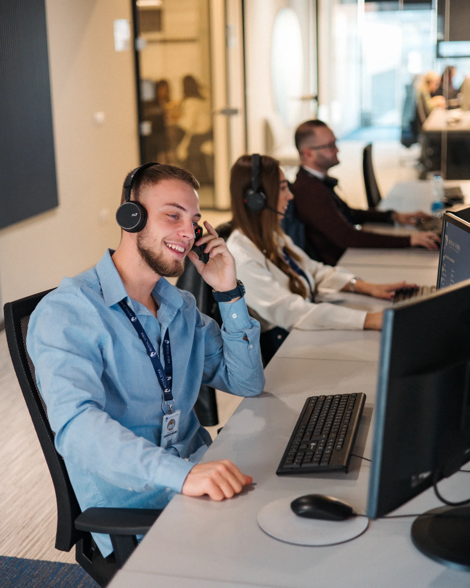 Royal York Property Management customer service representative with headset providing 24/7 multilingual landlord and tenant support