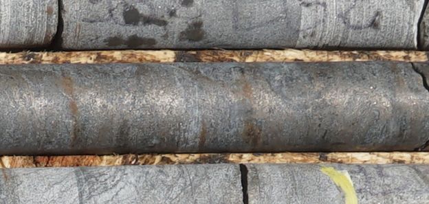 Core photo from LB-24-29 at 954 m, showing 2.20 m of semi-massive pyrrhotite with minor chalcopyrite mineralization with magmatic banding. Analytical results are pending. Additional DHTEM surveys are planned.