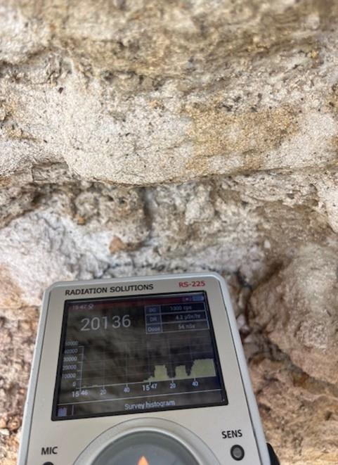 A hand holding a device AI-generated content may be incorrect.